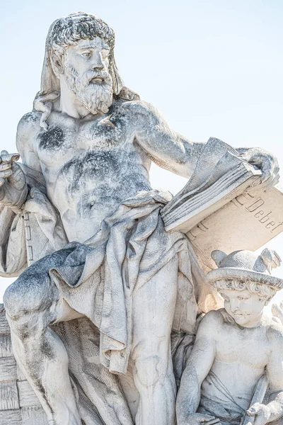 Sculpture of scientist with a book and his scholar on Zoll Bridg — Stock Photo, Image