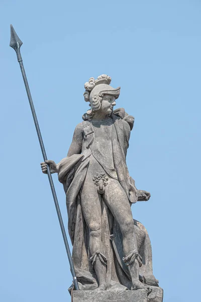 Ancient top roof statue of a naked knight in armor and with a sp — Stock Photo, Image