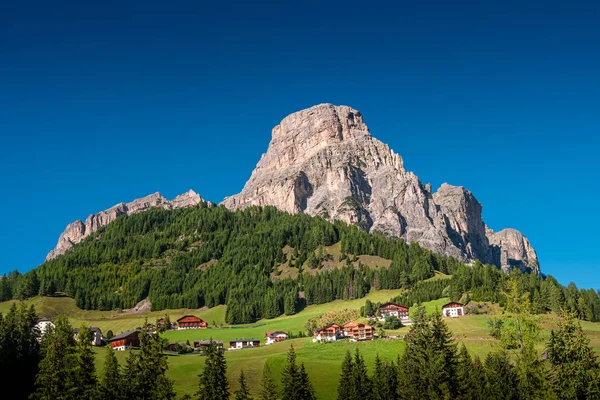 Panoramic view of magical Dolomite peak Sassongher, forests, val — Stock Photo, Image