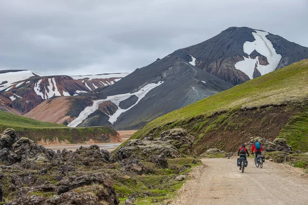 Two Cross Country Cyclists Approaching Major Campsite Colorful Rainbow Volcanic — Stock Photo, Image