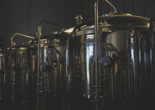Stainless tanks for fermentation in a beer brewery.