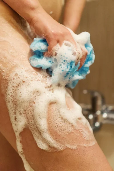 Woman Washing Her Legs Sponge Shower — Stockfoto