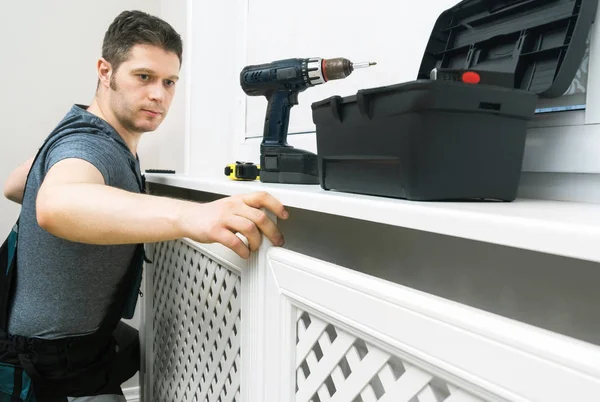 Professional Handyman Assembling Radiator Cabinet Home — Stock Photo, Image