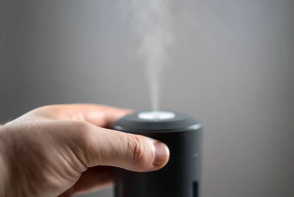 Man Hand Turning Electric Air Humidifier — Stock Photo, Image