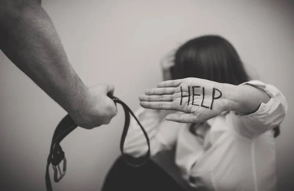 Man with belt coming to his wife. Home violence concept . — Stock Photo, Image