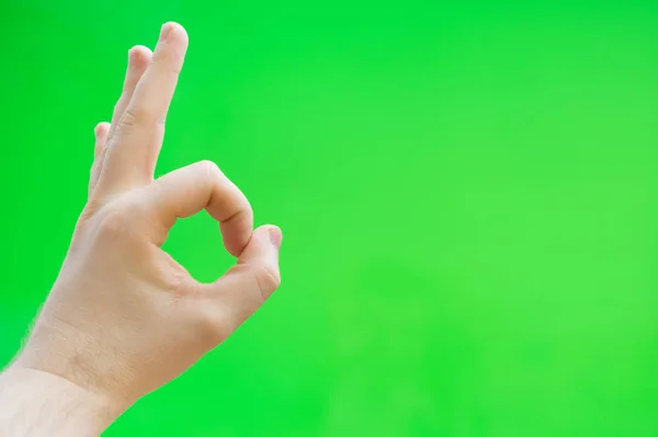 Male hand shows ok gesture. Chroma key. Place for your advertisement. — Stock Photo, Image