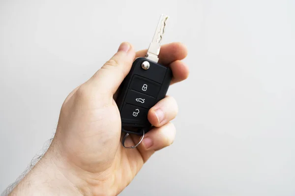 Male hand holding keys from car. Place for text. — Stock Photo, Image