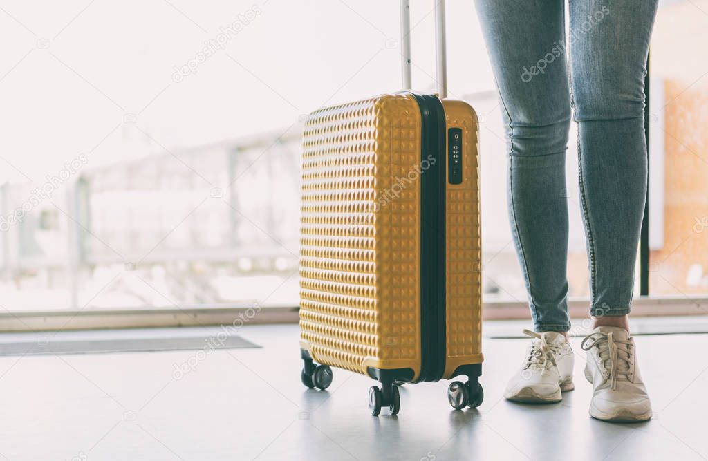 Woman with luggage in the airport.