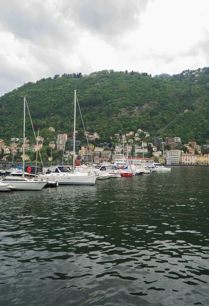 Many yachts and boats in the harbor of Como, Italy. — Stock Photo, Image