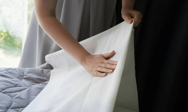Room service. Woman making bed in hotel room. — Stock Photo, Image