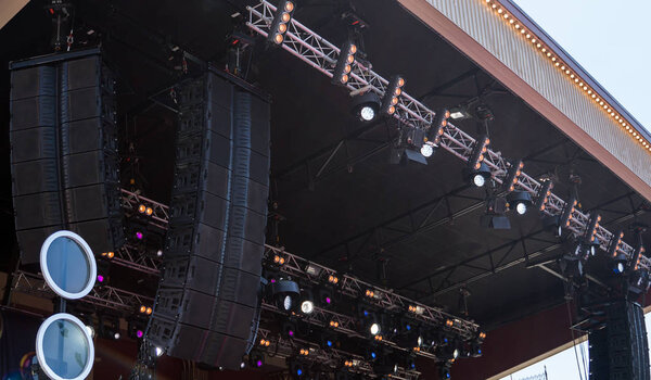 Concert stage with professional loudspeakers and lightning.