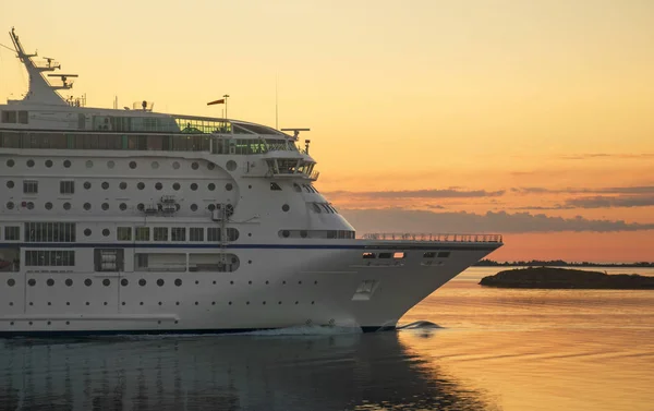 Passenger ferry against a sunset in the Baltic sea. — Stock Photo, Image