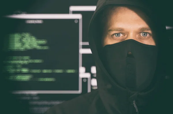 Hacker in black mask. Hacking and internet security concept. — Stock Photo, Image