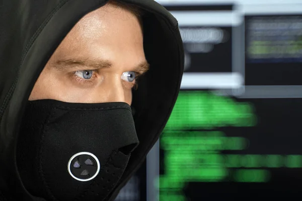 Hacker in black mask. Hacking and internet security concept. — Stock Photo, Image