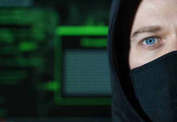 Hacker in black mask. Hacking and internet security concept. — Stock Photo, Image