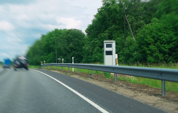 Modern speed camera on the freeway.