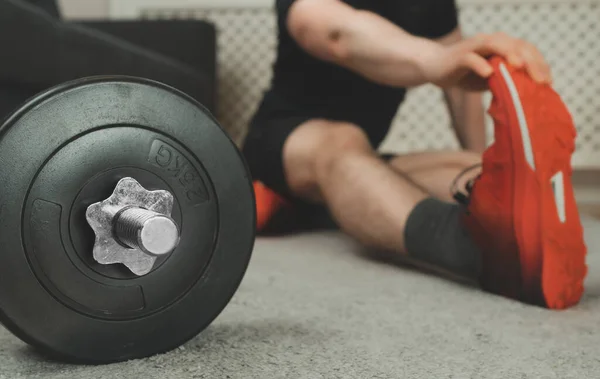 Man Stretches His Leg Exercise Home Fitness Training Concept — Stock Photo, Image