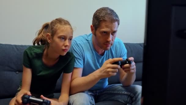 Dad His Daughter Playing Console Game Wireless Joysticks — Stock Video