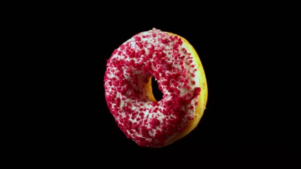 Fliegender Rosa Glasierter Donut Mit Streusel — Stockvideo