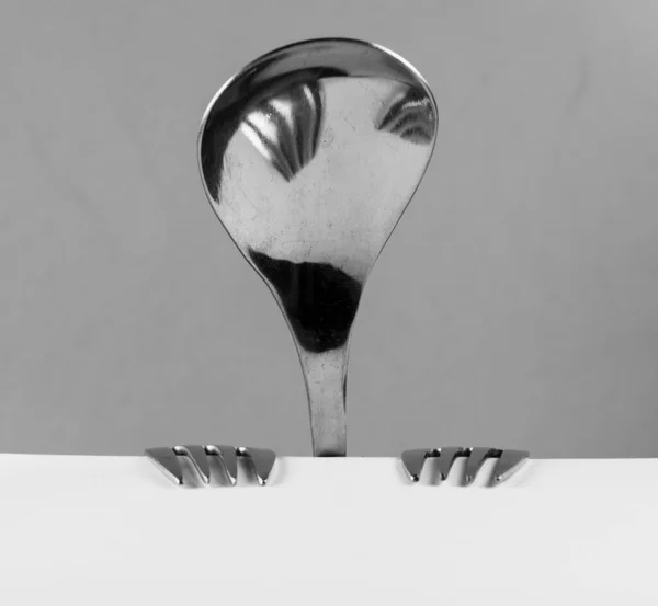 Abstract Person Made Spoon Forks Sitting Table — Stock Photo, Image