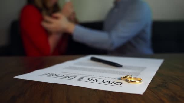 Divorce Decree Document Man Calms Woman Background — Stock Video