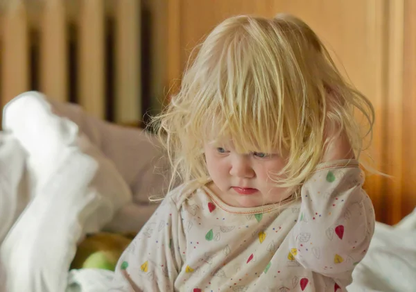 cute sleepy girl in bed in the early morning