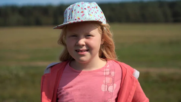 Active lifestyle of modern children - portrait of a nice blonde girl on the field — Stock Photo, Image