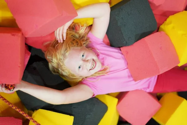 Happy Childhood Modern Child City Girl Lies Soft Cubes Amusement — Stock Photo, Image