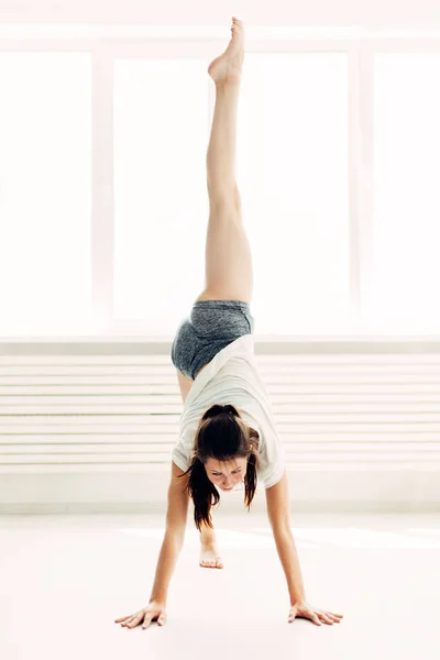 Young beautiful girl doing warm-up contemporary at home — Stock Photo, Image