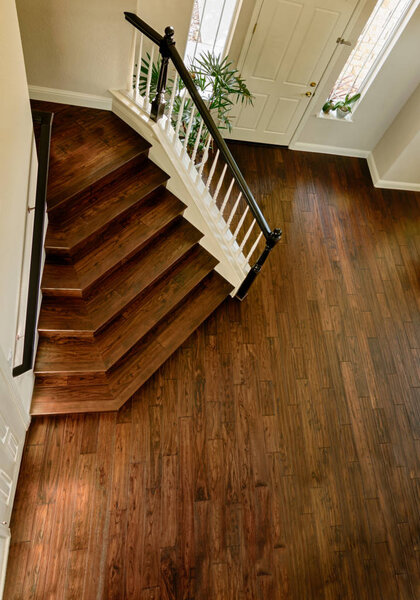 modern wooden staircase and hardwood floor, brown hardwood