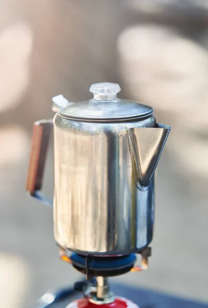 Steel travel kettle on the primus fire