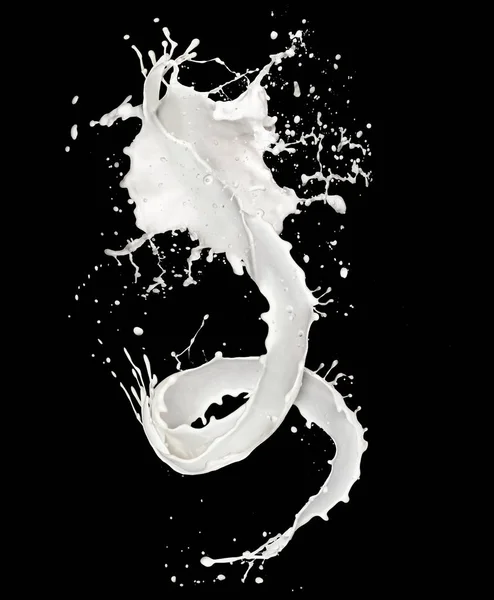 Salpicadura abstracta de leche aislada sobre fondo negro — Foto de Stock