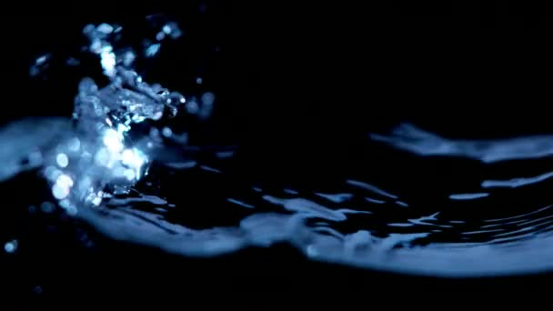 Super slow motion of water waves on black background — Stock Video