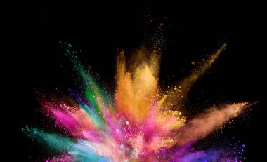 Explosion of coloured powder isolated on black background. Abstract colored background clipart