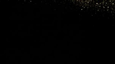 Süper ağır çekim, pırıltılı gümüş parçacıkları siyah arka plan üzerine, odak derinliği sığ. Yüksek hız sinema Kamerası, 1000 fps üzerinde filme.