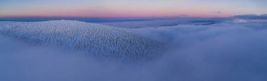 Aerial view of European winter snowy landscape, Czech republic. Winter nature panoramic view during sunrise clipart