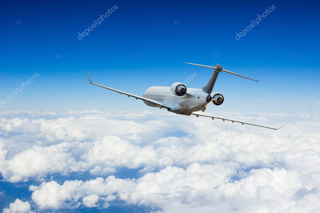 Passengers commercial airplane flying above clouds. Concept of fast travel, holidays and business.