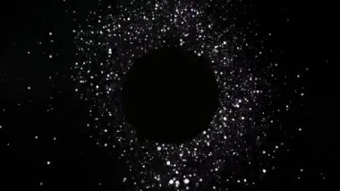 Süper ağır çekim boş daire ile ışıltılı parçacıklar patlaması. Yüksek hız sinema kamerası, 1000 fps üzerinde filme.