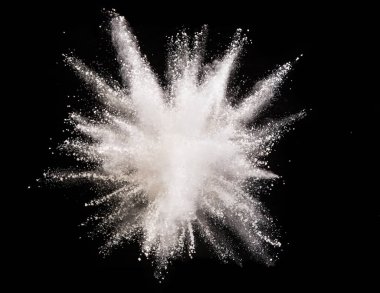 Explosion of white powder isolated on black background. Abstract colored background clipart