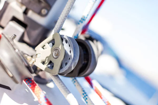 Sailboat winch with rope on yacht deck. Detail, low depth of focus. Leasure activities and extreme sport. Low depth of focus.