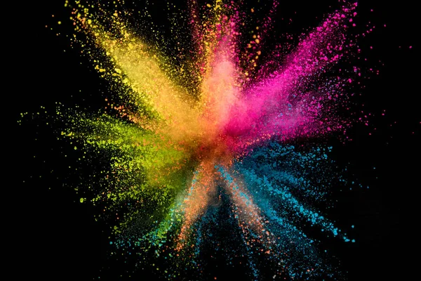 Explosion of colored powder isolated on black background. Abstract colored background