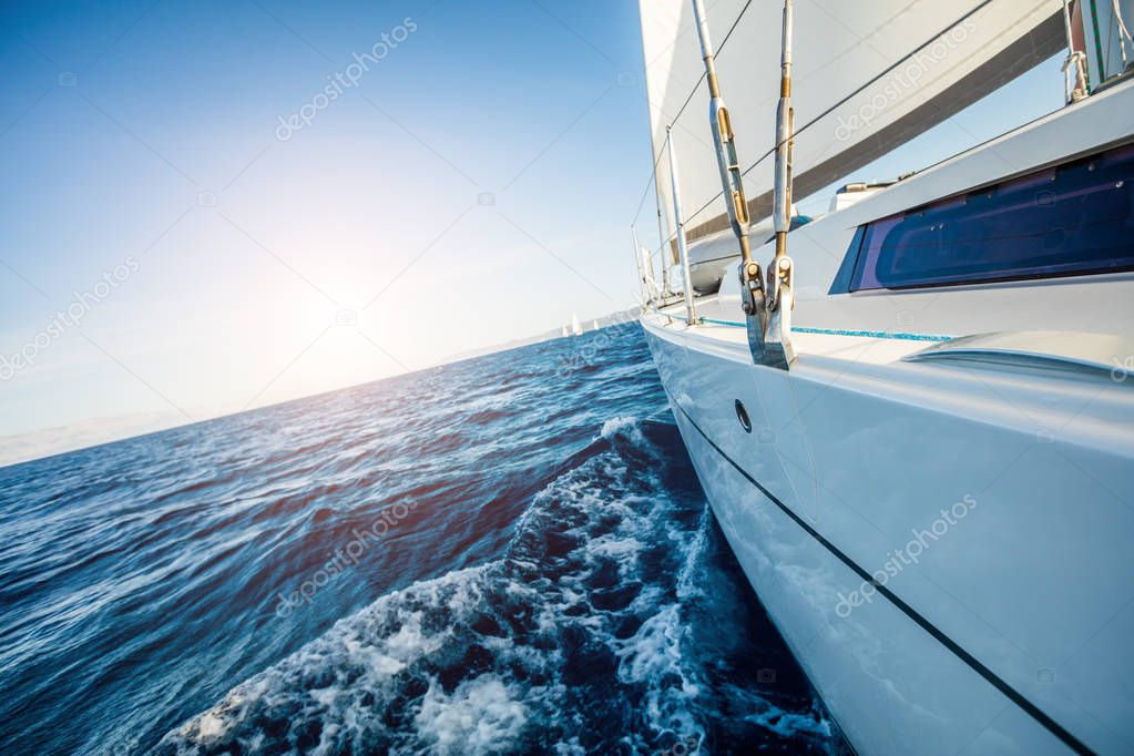 Detail of sailing yacht during voyage. Summer sport and recreation activities.