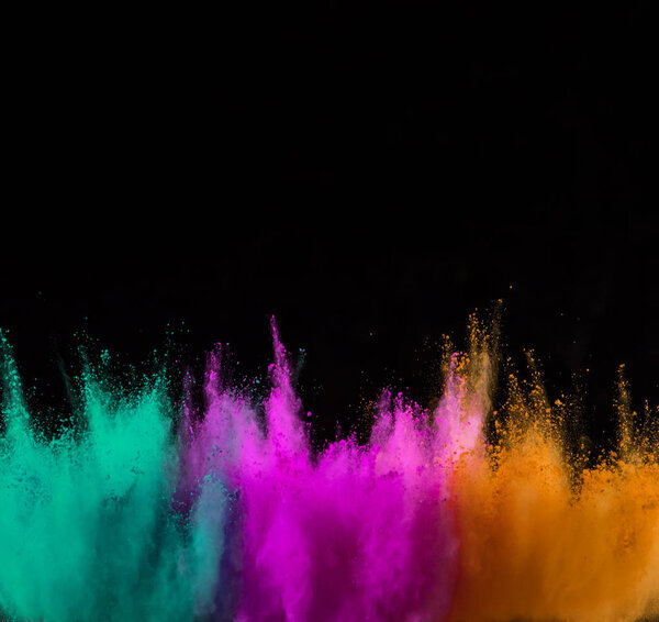 Explosion of colored powder isolated on black