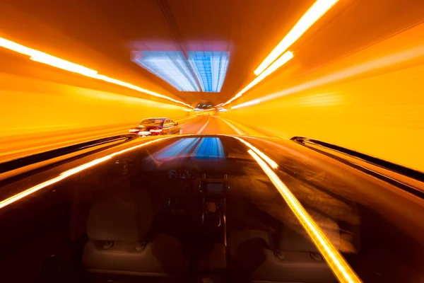 POV of car driving at night city with motion blur — Stock Photo, Image
