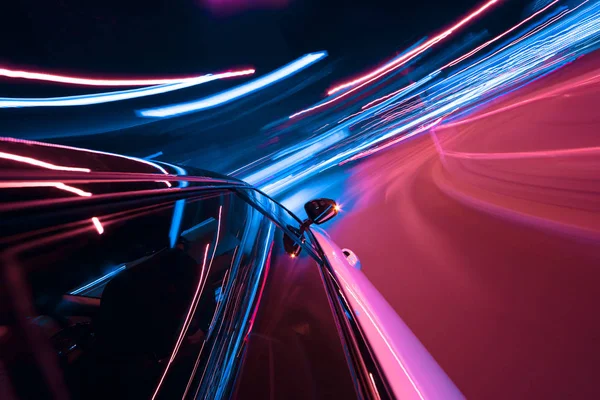 POV of car driving at night city with motion blur — Stock Photo, Image