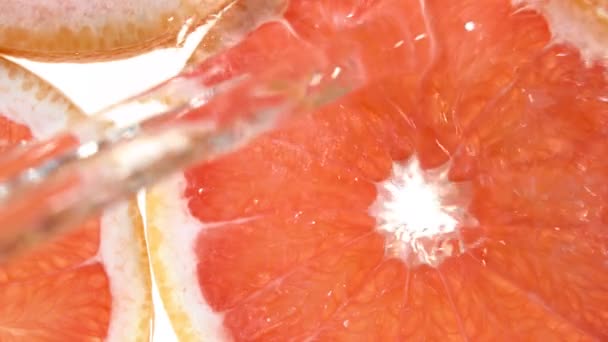 Super Slow Motion Grapefruit Slices Water Splash Filmed High Speed — Stock Video