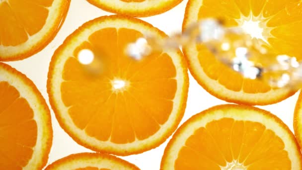 Super Zeitlupe Von Orangenscheiben Mit Wasserspritzern Gefilmt Mit High Speed — Stockvideo