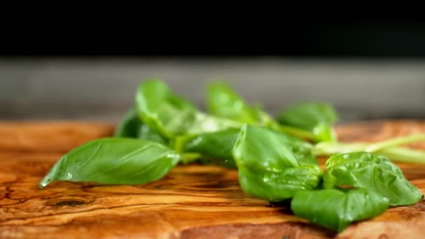 Super Slow Motion Falling Basil Cutting Board — Stock Video