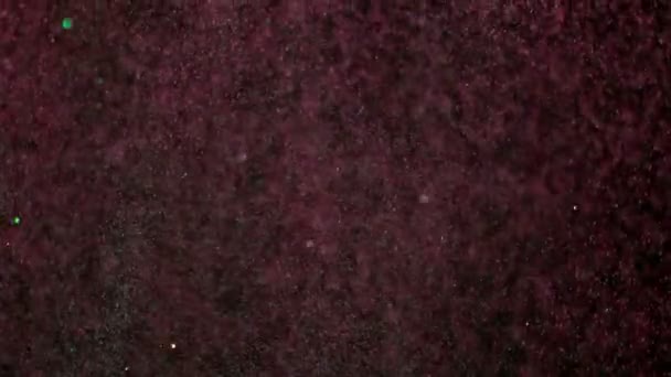 Super Cámara Lenta Partículas Color Brillante Sobre Fondo Negro Bajo — Vídeos de Stock