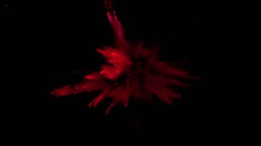 Siyah zemin üzerinde izole edilmiş çok yavaş renkli toz çarpışması. Yüksek hızlı sinema kamerası, 1000fps.